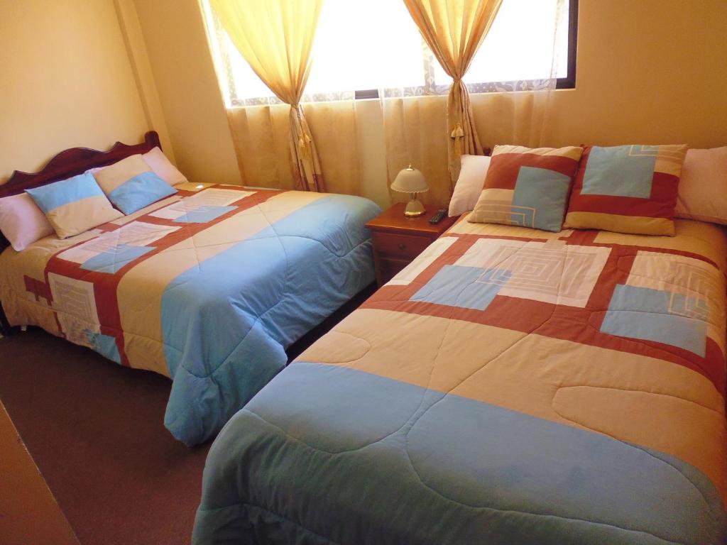 Postel nebo postele na pokoji v ubytování Hotel Residencial El Viajero
