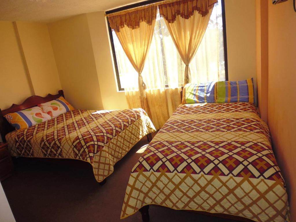Postel nebo postele na pokoji v ubytování Hotel Residencial El Viajero