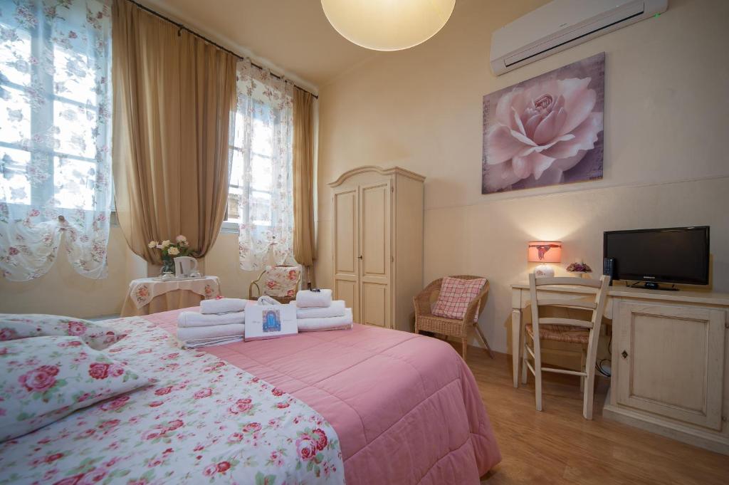 Postel nebo postele na pokoji v ubytování Albergo Etruria
