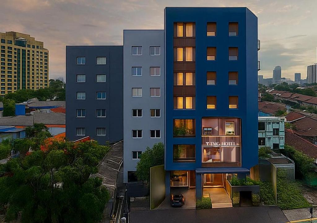 a blue building on top of a city at TMG Hotel Tebet, Marclan Collection in Jakarta