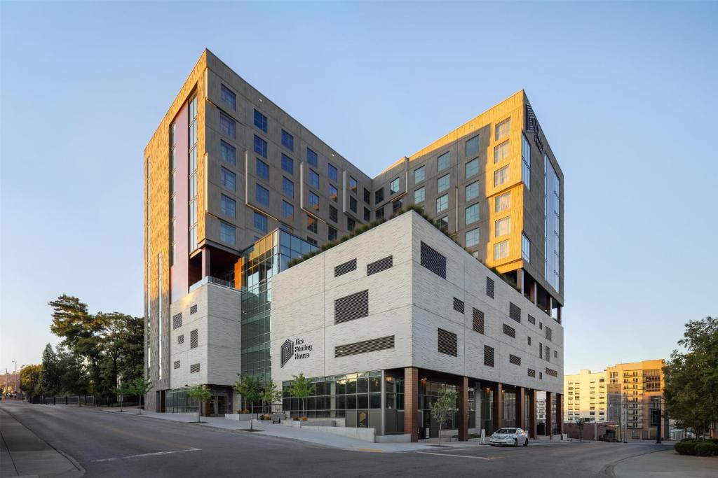 a building on a street with a car parked in front at The Printing House Hotel, Tapestry Collection By Hilton in Nashville