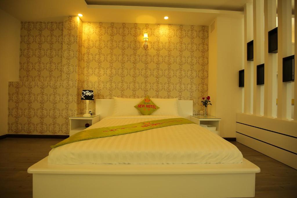 Postel nebo postele na pokoji v ubytování New Hotel & Apartment