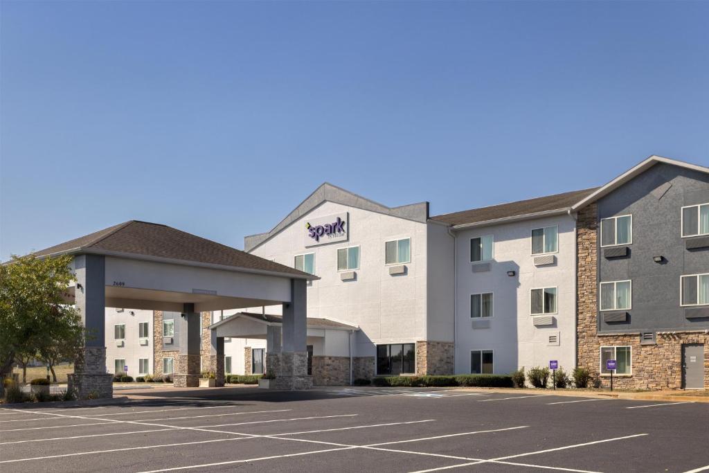 a rendering of a hotel with a parking lot at Spark By Hilton Ames in Ames