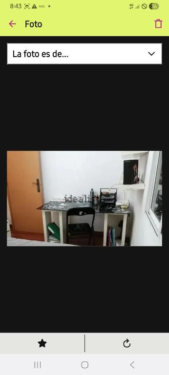 a picture of a desk in a room with a table at villa Amparo in Villaviciosa de Odón