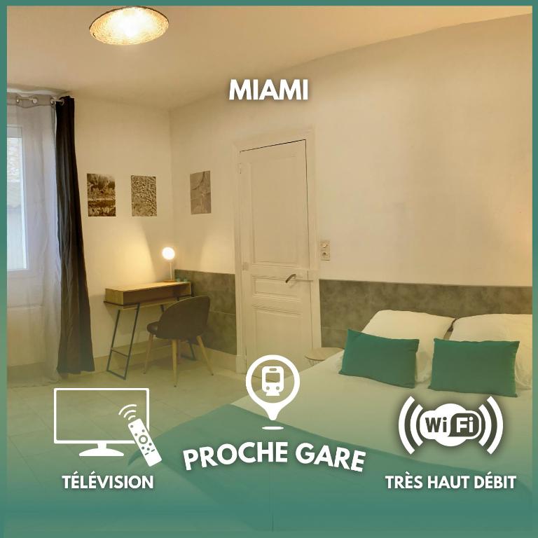 a bedroom with a bed and a table with a desk at Room Miami Proche Gare 400m in Montargis