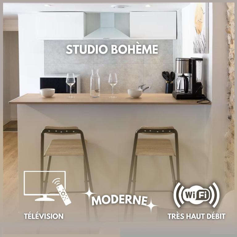 two bar stools sitting at a counter in a kitchen at Studio Bohème - Centre Ville in Montargis