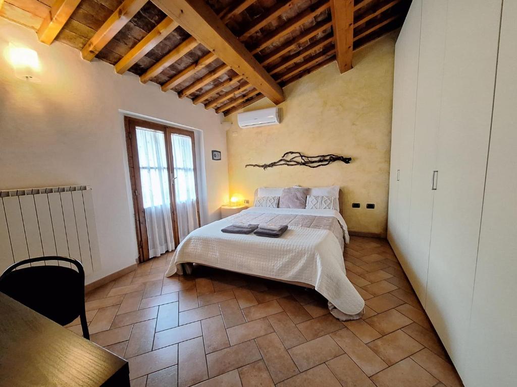 Postel nebo postele na pokoji v ubytování benvenuti al piccolo mulino