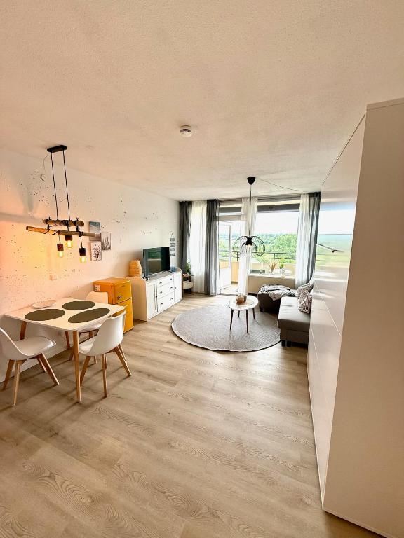 a living room with a table and a couch at Seebrise in Wendtorf