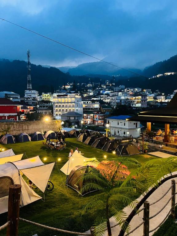 a view of a city at night with tents at Ndalem Prabu Sarangan in Sarangan
