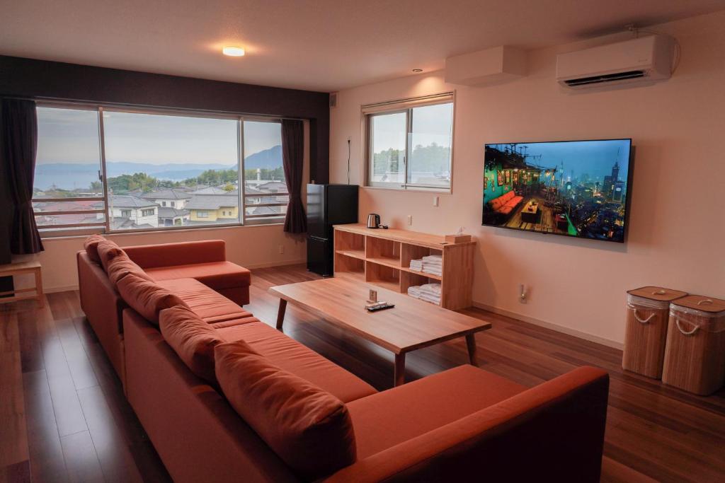 TV a/nebo společenská místnost v ubytování Beppu Ohana