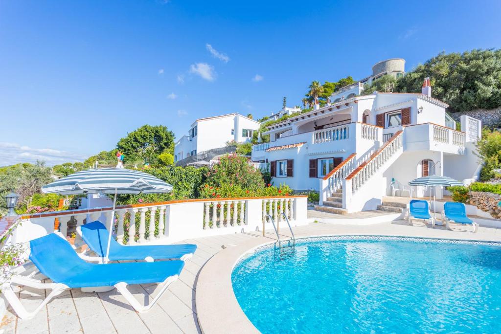 a villa with a swimming pool and a house at V60A Villa Lucia in Son Bou
