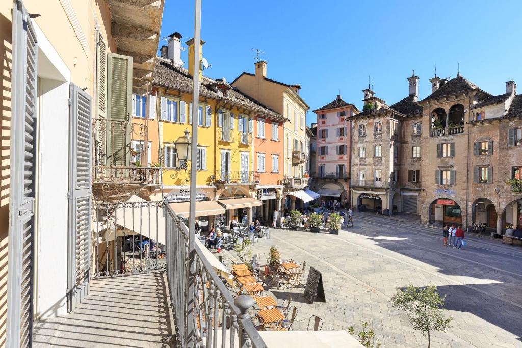 a view of a street in a city with buildings at Piazza Mercato14 in Domodossola