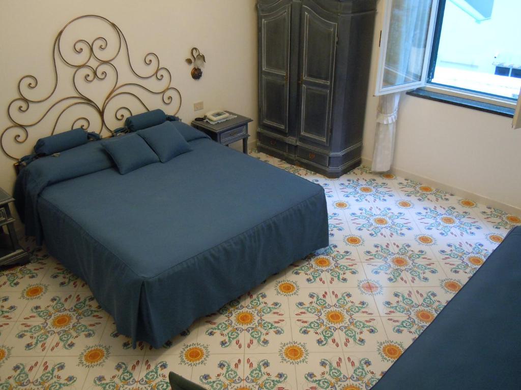 Postel nebo postele na pokoji v ubytování Hotel Alfonso A Mare