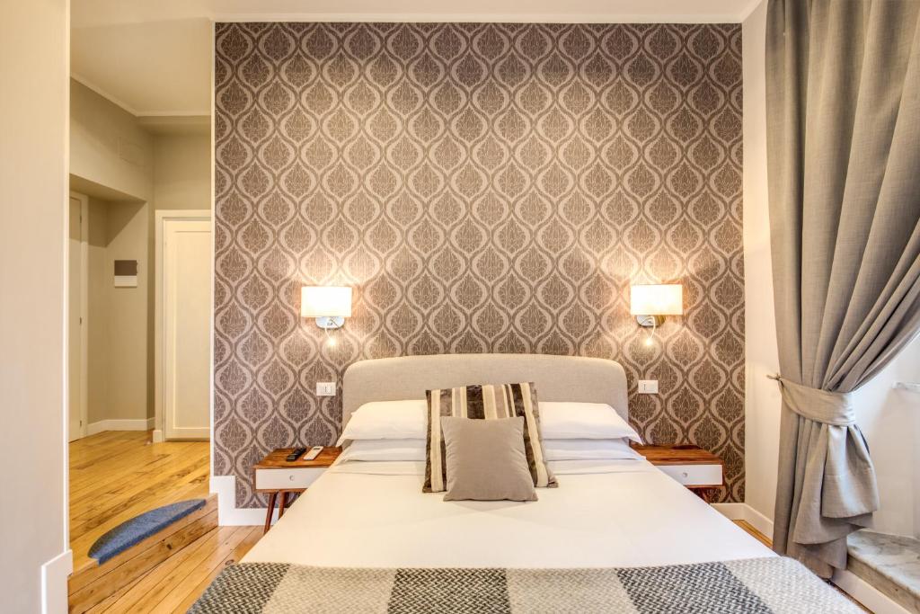Letto o letti in una camera di The Club Navona