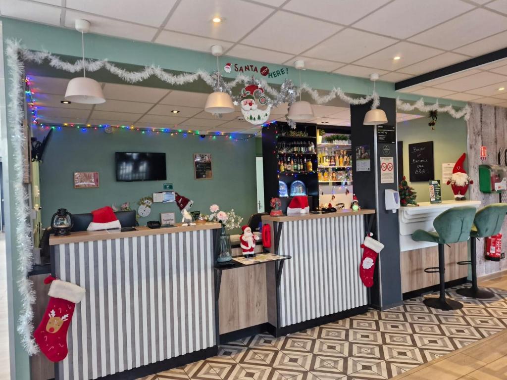 a christmas store with santa hats on the counter at B&B HOTEL Massy Gare TGV in Massy