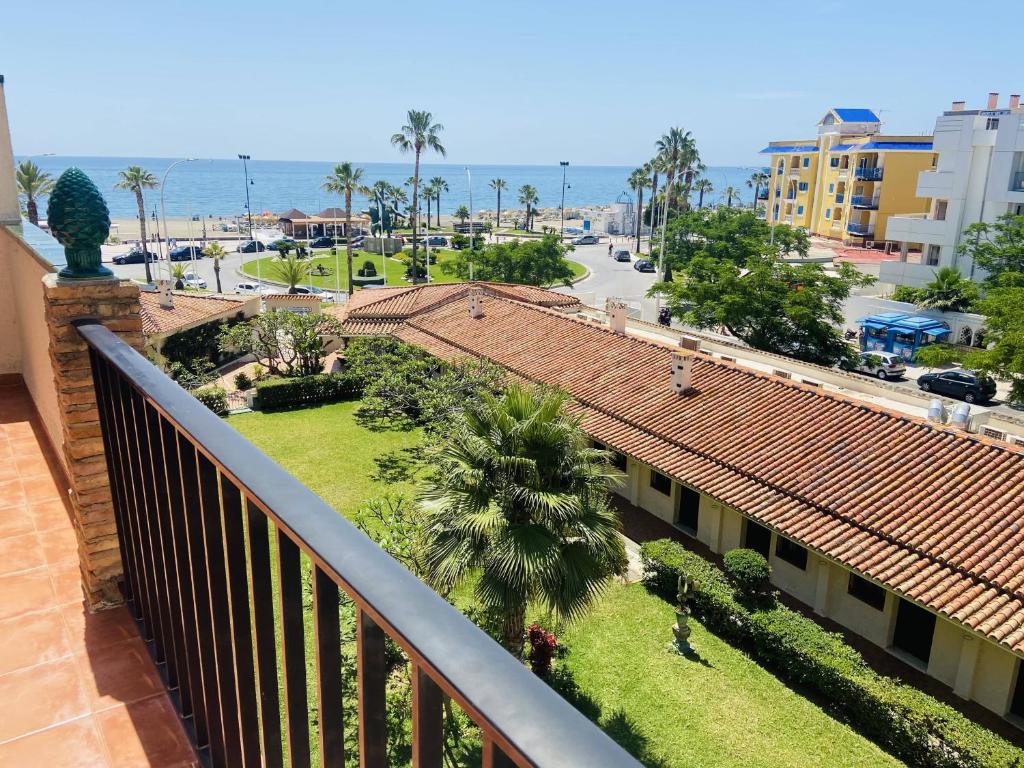 a balcony of a building with a view of a street at Apartamentos Los Jazmines in Torremolinos
