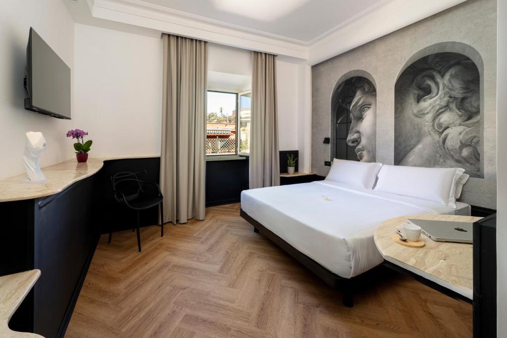 Un pat sau paturi într-o cameră la Boutique Hotel Travé