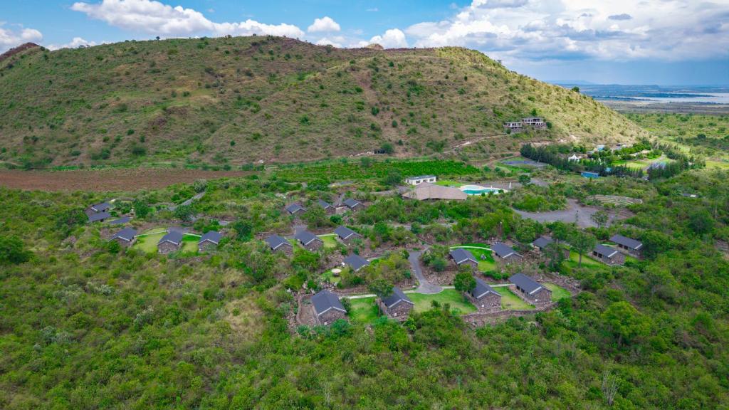 an aerial view of a house on a hill at Sleeping Warrior Camp Elementaita in Nakuru