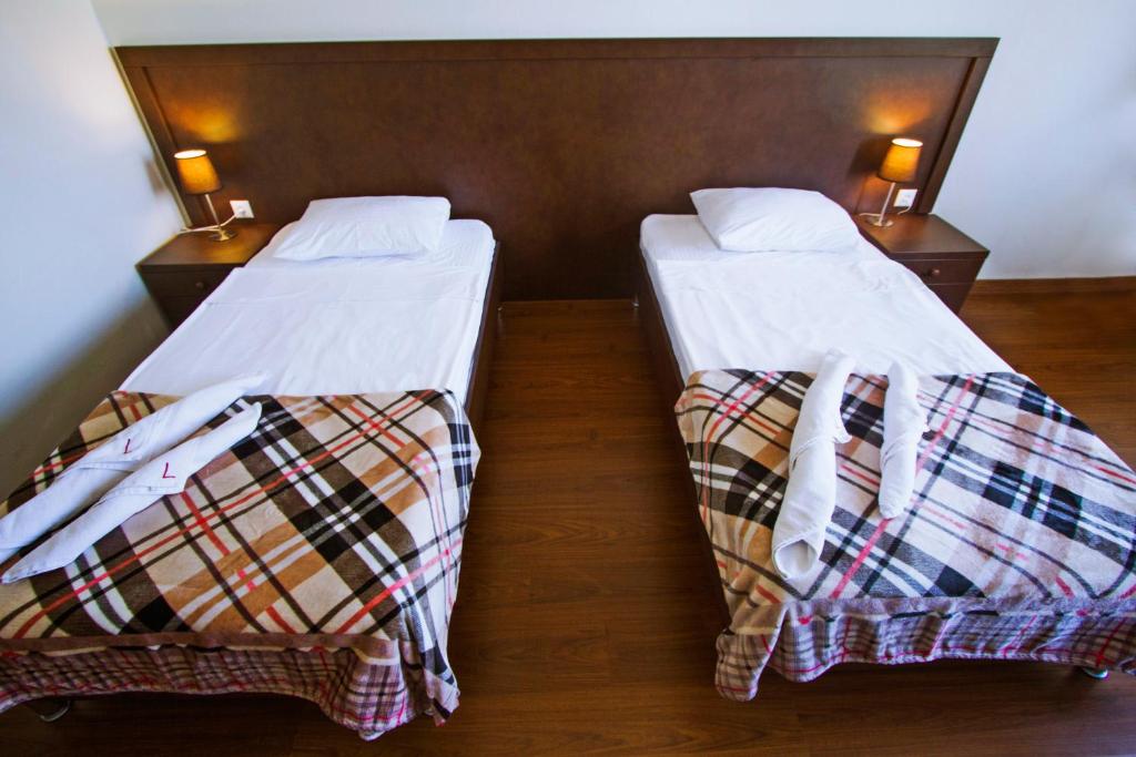 Postel nebo postele na pokoji v ubytování Hotel Lux
