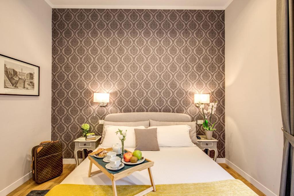 Letto o letti in una camera di The Club Navona