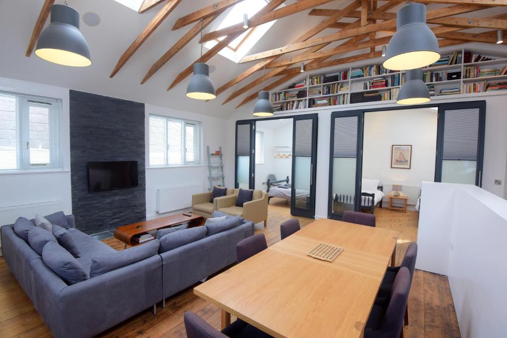 a living room with a couch and a table at Ebenezer Hall in Falmouth