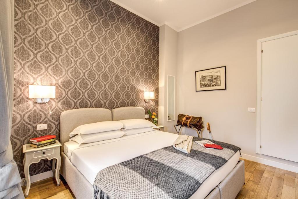 Letto o letti in una camera di The Club Navona