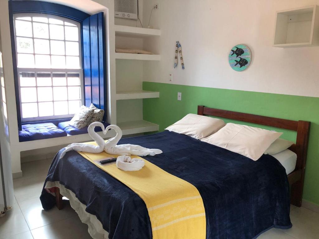 Postel nebo postele na pokoji v ubytování Brisa da Praia Colonial