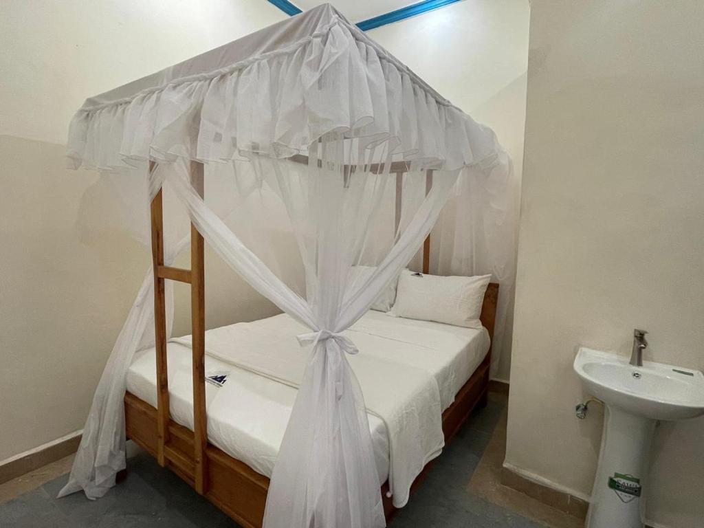 Giường trong phòng chung tại Palace Guest House