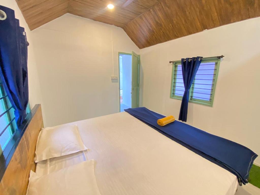 En eller flere senge i et værelse på village cottages