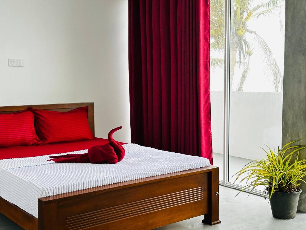 En eller flere senge i et værelse på Pearl Beach