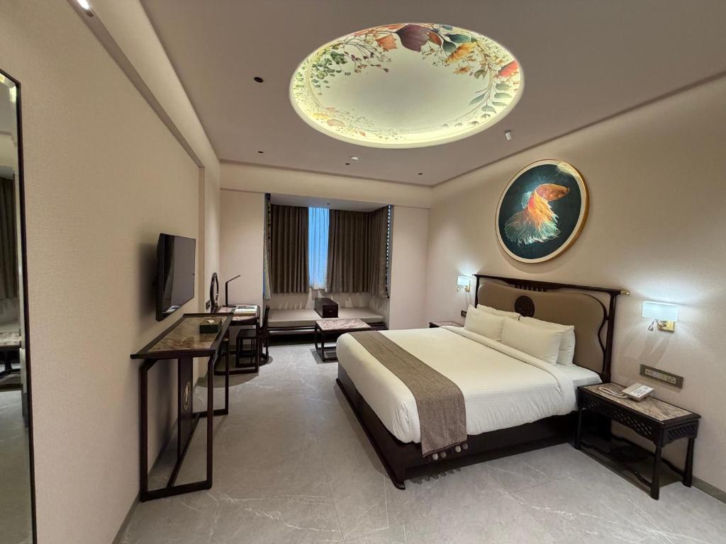 Ένα ή περισσότερα κρεβάτια σε δωμάτιο στο De Lush Pune