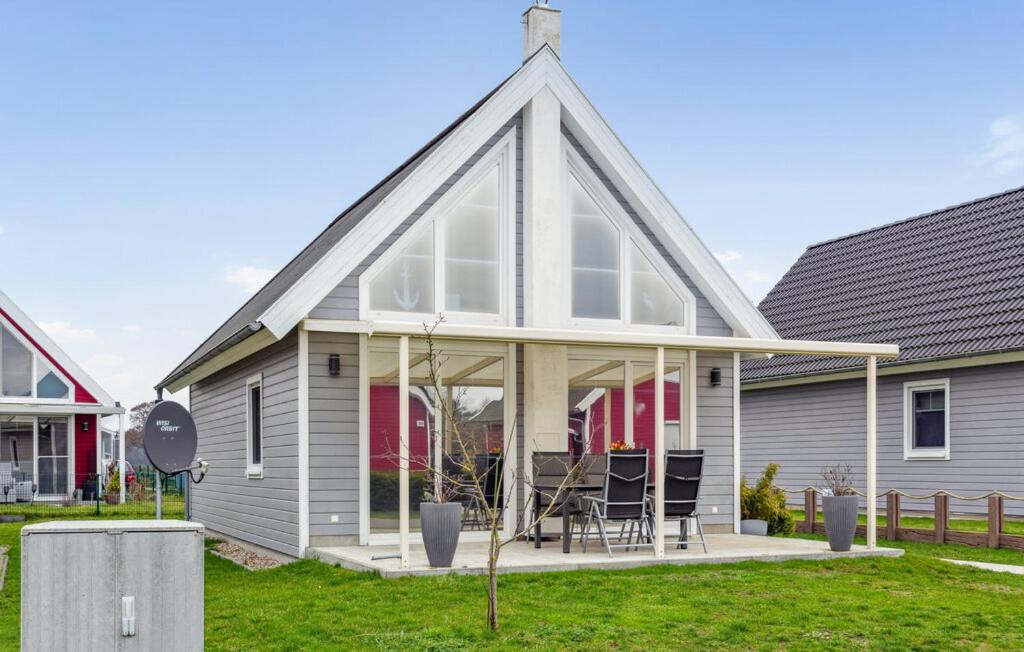 a house with a pitched roof with glass doors at Haus Hafen Liebe in Wandlitz