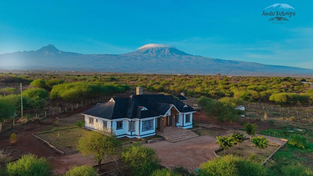an aerial view of a house with a mountain in the background at Andu Kuboiye Homes in Kimana
