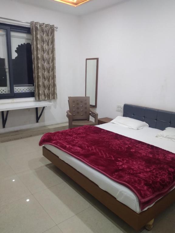 Ένα ή περισσότερα κρεβάτια σε δωμάτιο στο Prakash patel