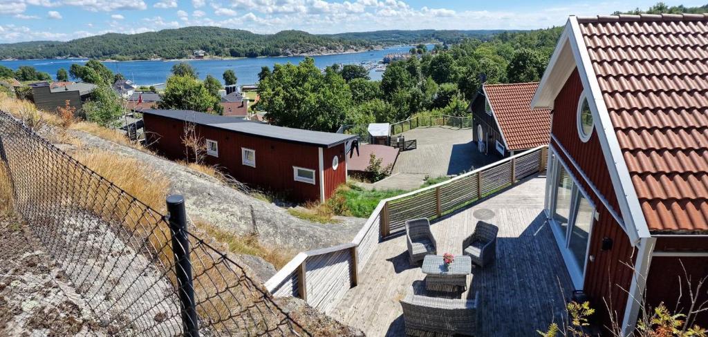 a view of a house with stairs and a view of a river at Modern Cottage with Sea View in Svanesund SE09151 in Svanesund