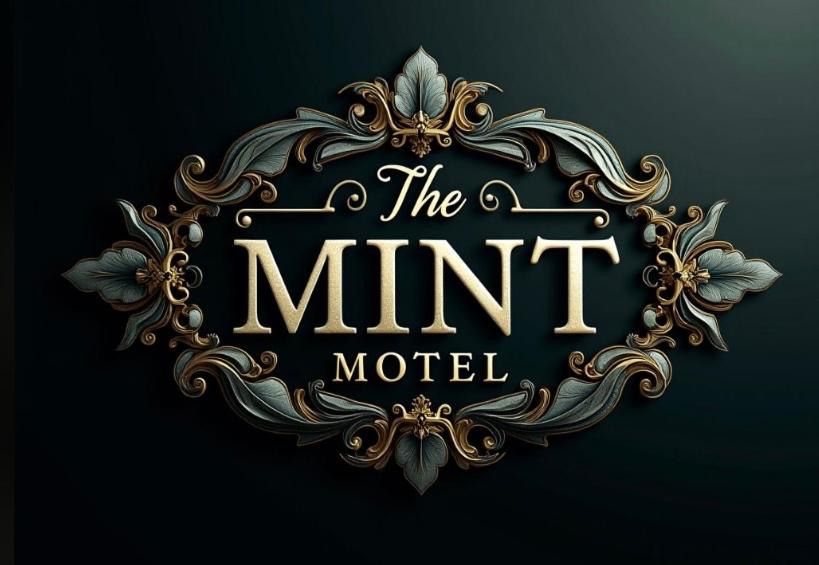 a black and gold logo for the mint model at The Mint Motel in Arlington