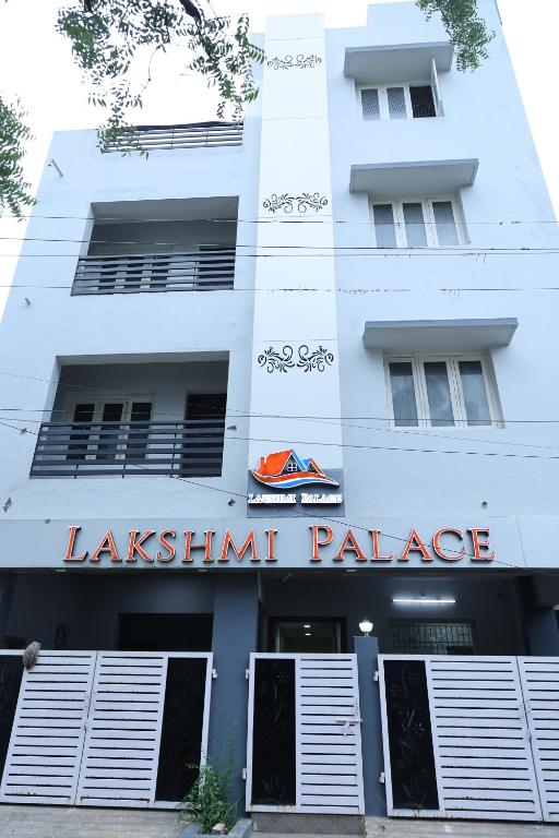 a building with a sign for alash island palace at Lakshmi Palace Near Madurai Bus Stand in Madurai
