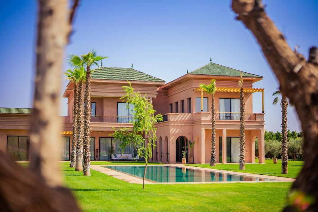 a large house with a pool in front of it at Villa Jumeirah M Luxury & Spacious Pool in Marrakech