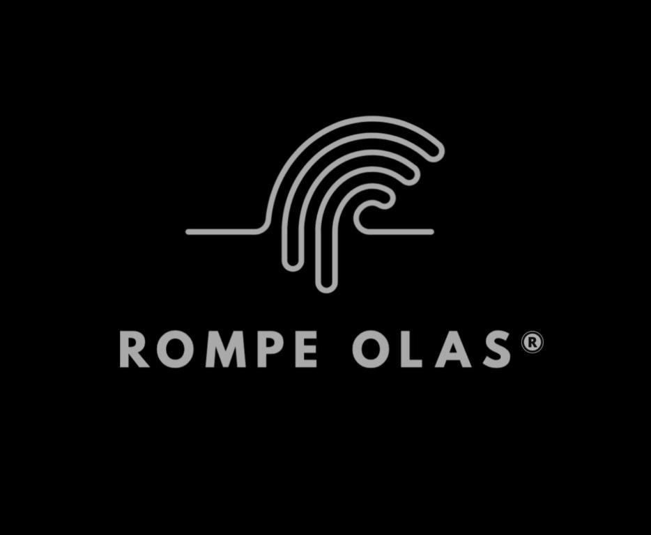 een logo voor een bedrijf genaamd Rome Ols bij Rompe Olas in Maitencillo