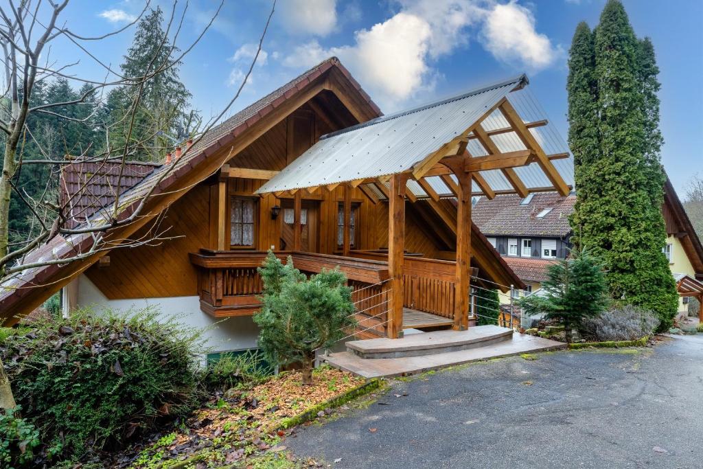 a large wooden house with a gambrel roof at Haus Sigmund in Waldhäuser