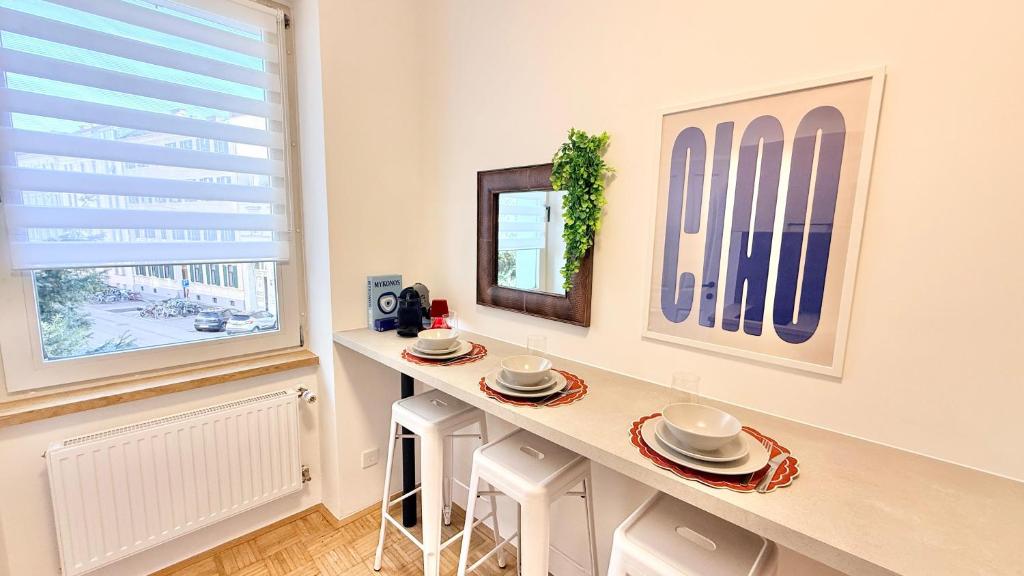 a kitchen with a table and a window at M8 ParkSide Studio One in Graz