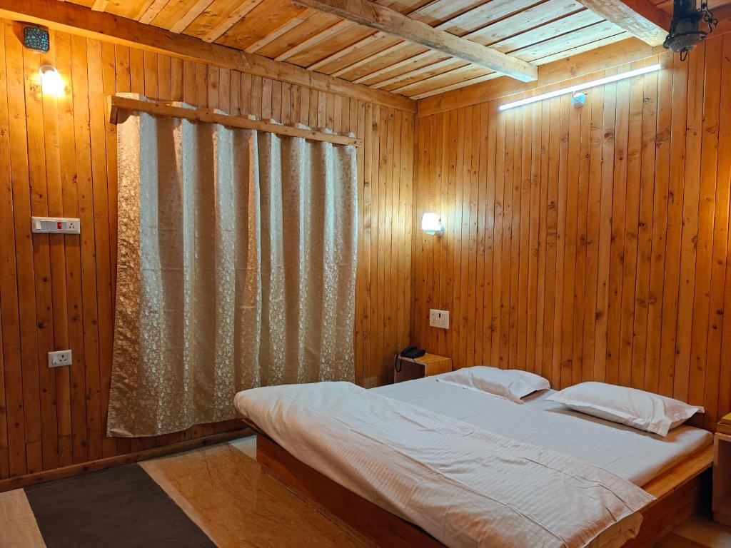 En eller flere senge i et værelse på Mistymountaincottage