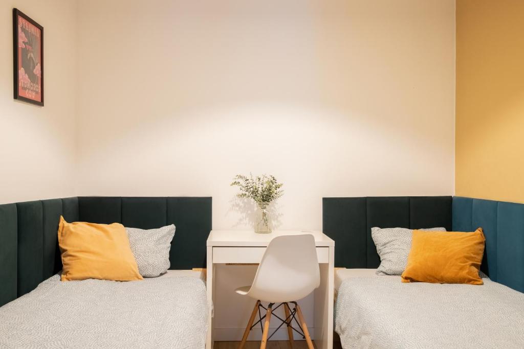 Ένα ή περισσότερα κρεβάτια σε δωμάτιο στο ADLER Apartments