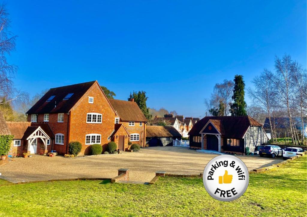 a house with a frisbee in front of it at Hillside Farm Barn in Woking