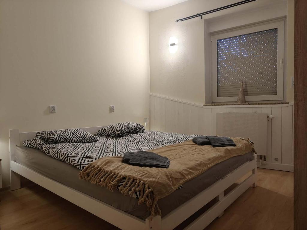 En eller flere senge i et værelse på Apartament Juliusz Slowacki