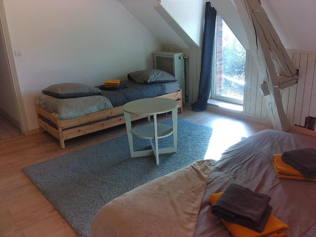 Ένα ή περισσότερα κρεβάτια σε δωμάτιο στο La Ballière, un havre de douceur et de prestige