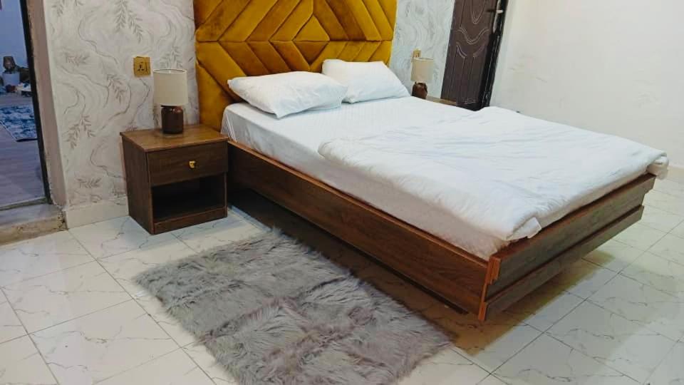 Ένα ή περισσότερα κρεβάτια σε δωμάτιο στο LuxApartments