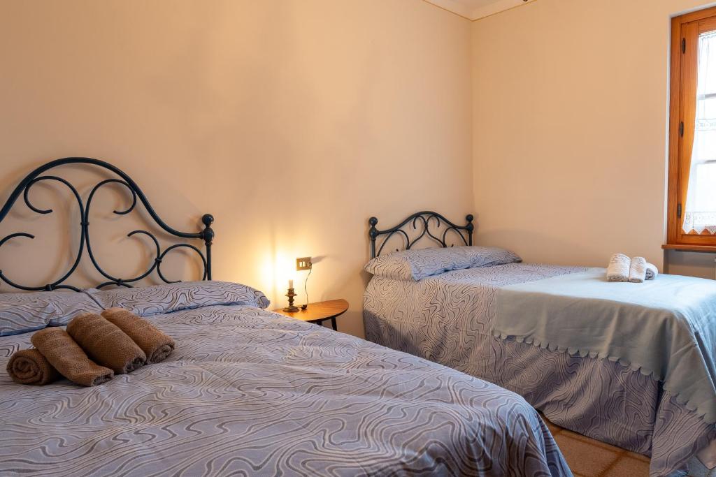 Ένα ή περισσότερα κρεβάτια σε δωμάτιο στο Poggio Loccano