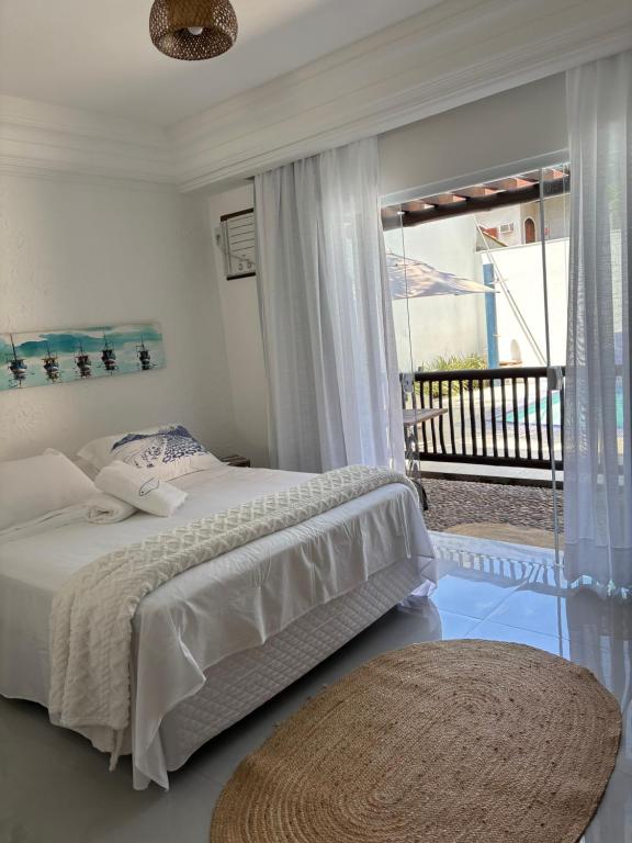 Ένα ή περισσότερα κρεβάτια σε δωμάτιο στο Almas gêmeas suíte 6