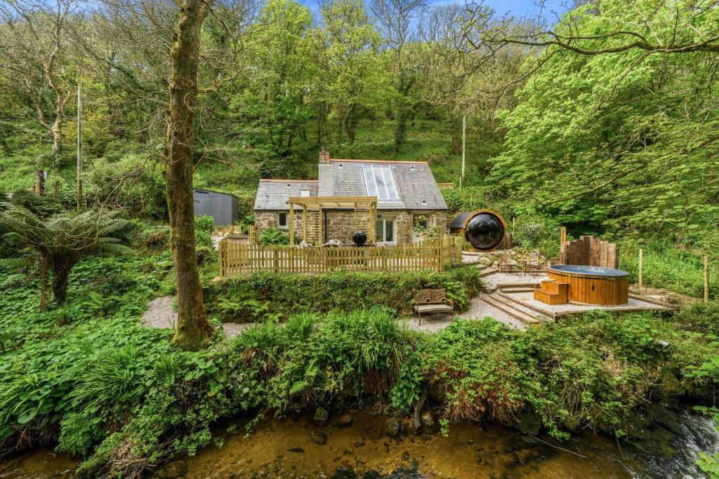 a house in the middle of a forest at Birch Studio in Camborne